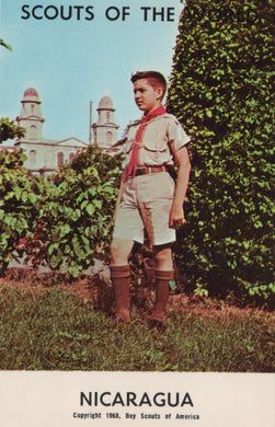 Scout standing outdoors with a building and trees in the background, labeled 'Scouts of the World, Nicaragua'.