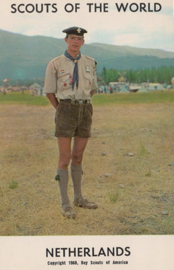 Scout in uniform standing outdoors with text 'Scouts of the World Netherlands'