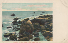 Load image into Gallery viewer, Vintage postcard of rocky coastline with ocean waves and a lighthouse in the background.
