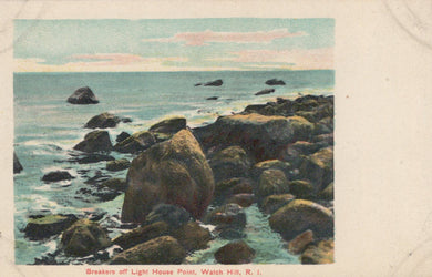 Vintage postcard of rocky coastline with ocean waves and a lighthouse in the background.
