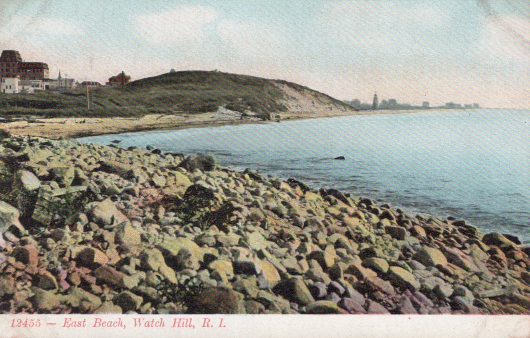 Vintage postcard of East Beach at Watch Hill, Rhode Island with rocky shoreline and distant buildings.