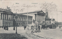 Load image into Gallery viewer, Vintage black and white photo of a city street with people and horse-drawn carriages, featuring architectural buildings.
