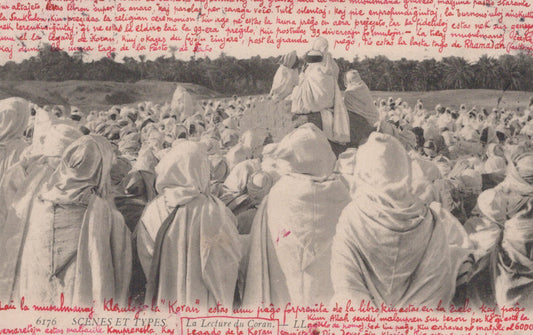 Vintage photograph of a large crowd of people wearing headscarves in a field.