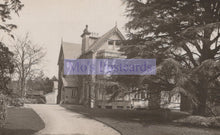 Load image into Gallery viewer, Vintage black and white photograph of a large house with a driveway and trees.
