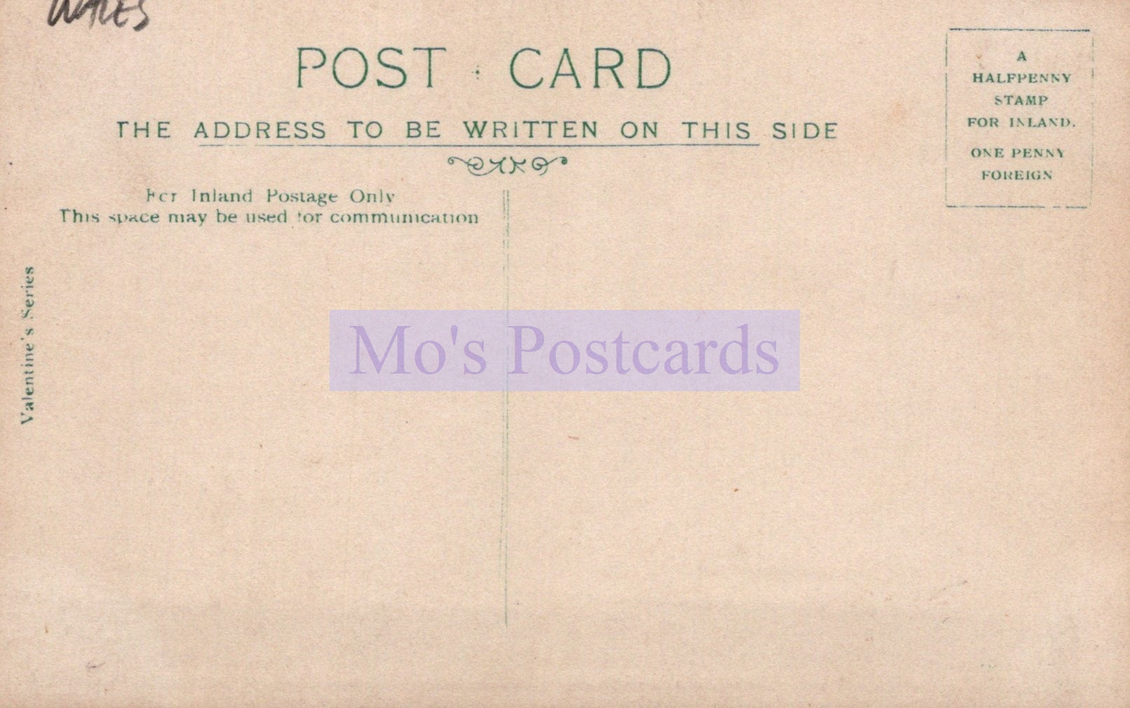 Vintage postcard with text and a stamp on a beige background