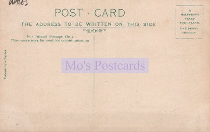 Vintage postcard with text and a stamp on a beige background