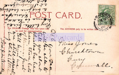 Vintage postcard with handwritten text and a stamp, featuring the word 'POSTCARD'.