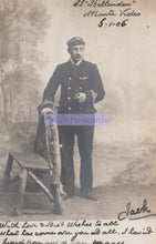 Load image into Gallery viewer, Vintage photograph of a man in uniform holding a rifle with text on a postcard.
