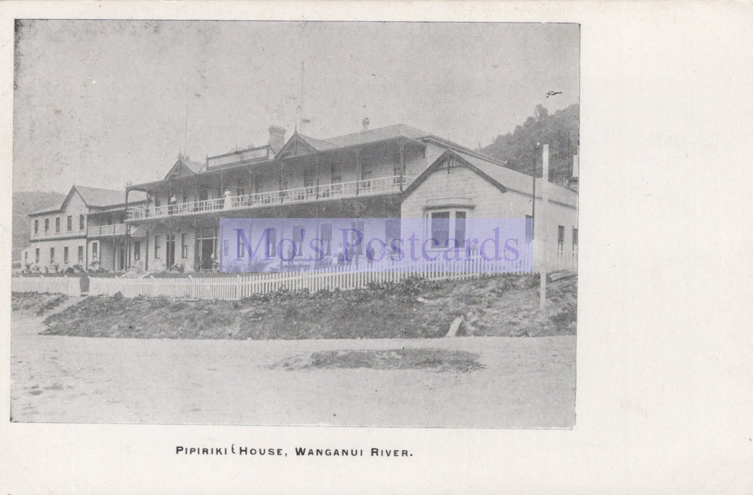 Vintage black and white photo of a large house on the Wanganui River with 'Moly Postcards' watermark.