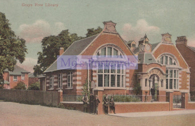 Vintage postcard of a brick building labeled 'Grays Free Library' with trees and people in front.