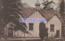 Load image into Gallery viewer, Vintage photograph of a school building with a steeple, surrounded by trees.
