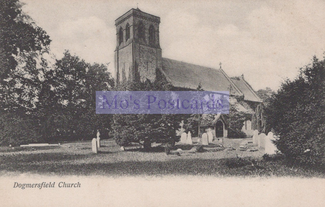 Vintage black and white photograph of a church with a steeple, surrounded by trees and grass.