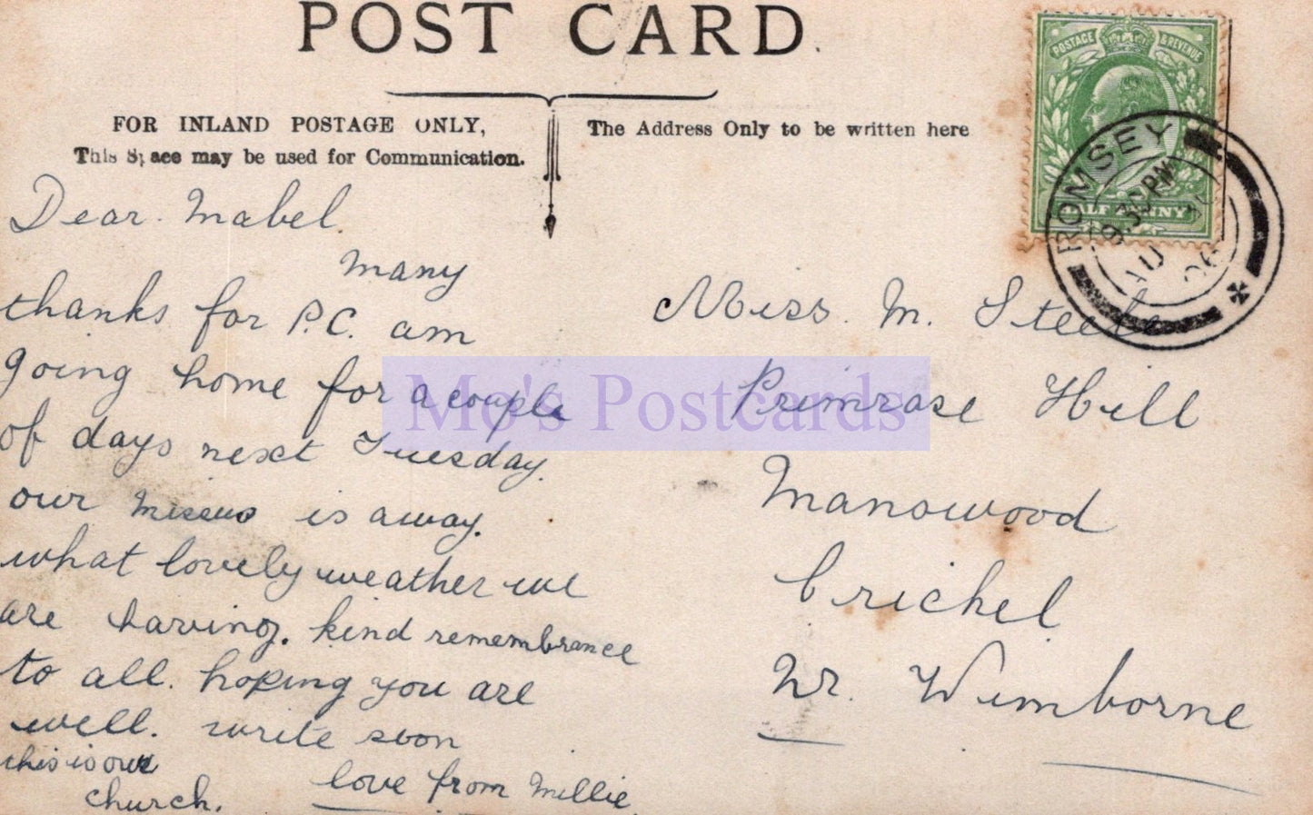 Vintage postcard with handwritten message and postage stamp