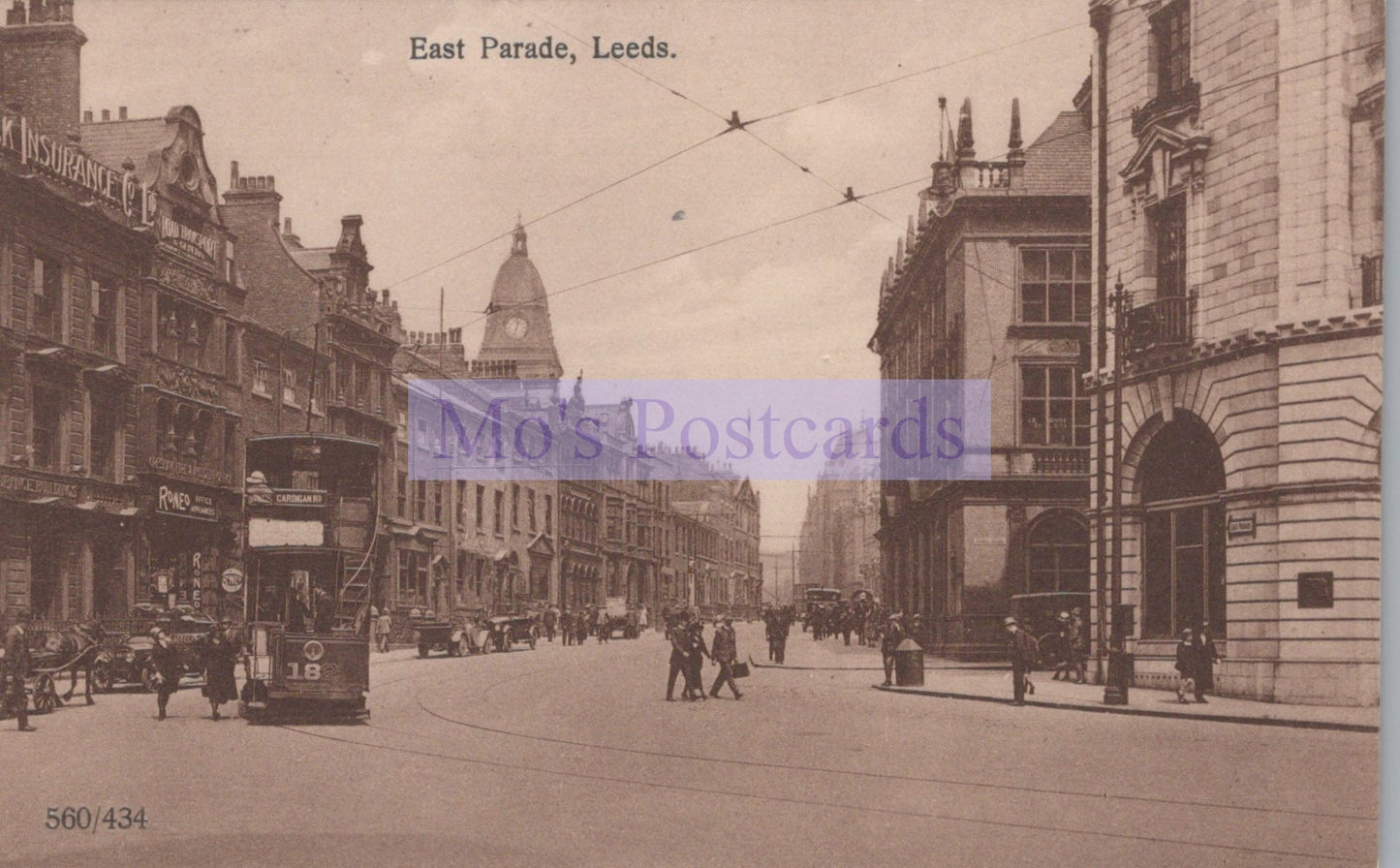 Vintage black and white photograph of a street scene in East Parade, Leeds with tram and pedestrians.