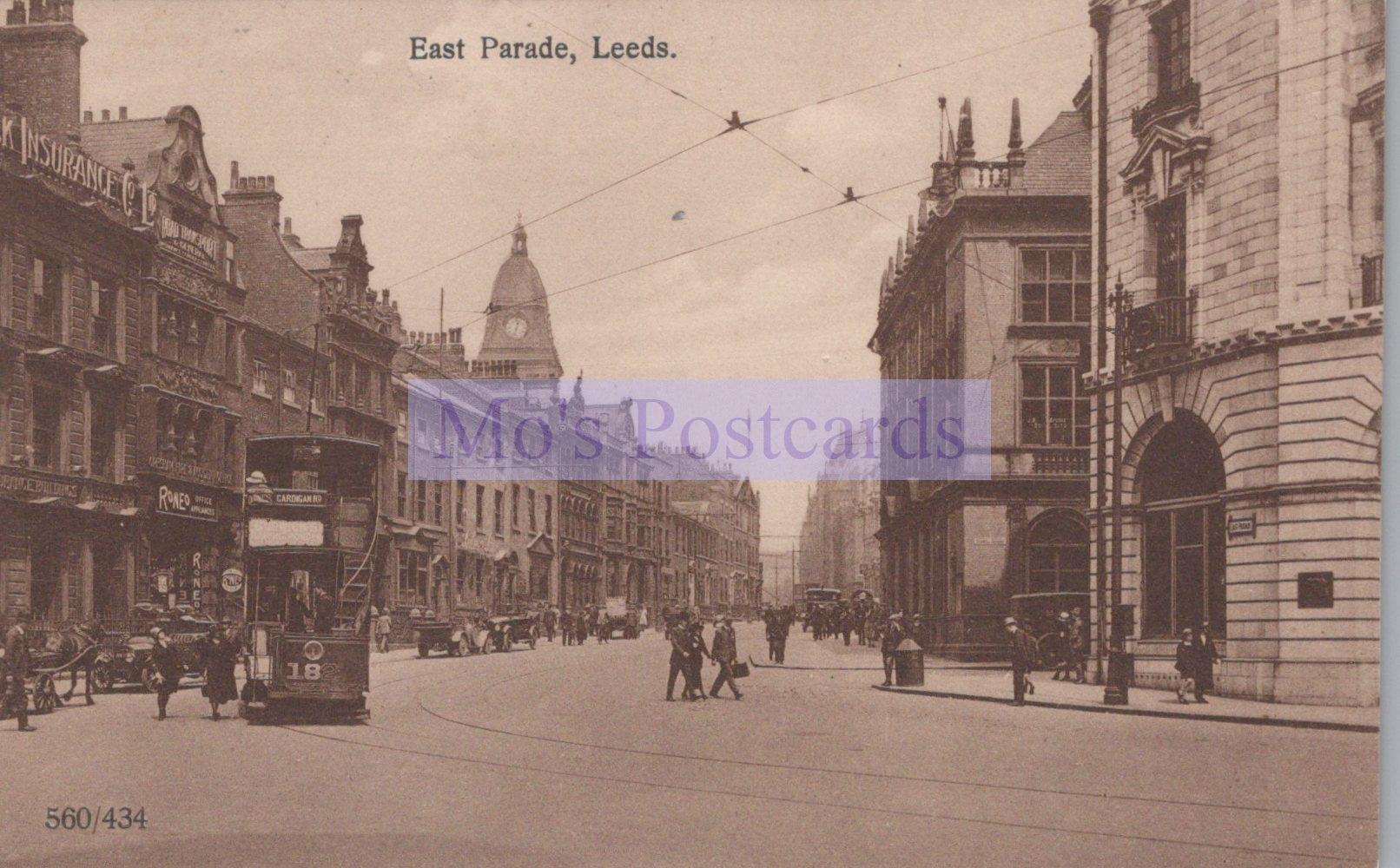 Vintage black and white photograph of a street scene in East Parade, Leeds with tram and pedestrians.