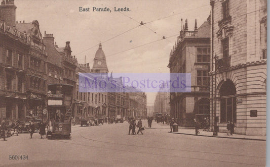 Vintage black and white photograph of a street scene in East Parade, Leeds with tram and pedestrians.