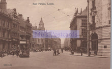 Load image into Gallery viewer, Vintage black and white photograph of a street scene in East Parade, Leeds with tram and pedestrians.
