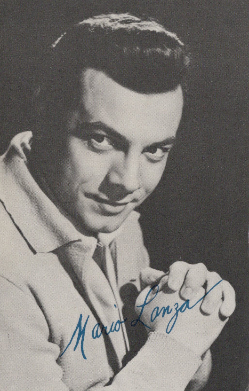 Black and white portrait of a man with a signature at the bottom