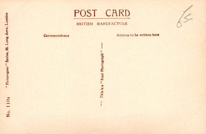 Vintage postcard with text fields for correspondence and address, featuring a British manufacture label.