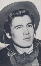 Load image into Gallery viewer, Vintage photo of a person wearing a cowboy hat and scarf with &#39;Chris Jones&#39; signature.
