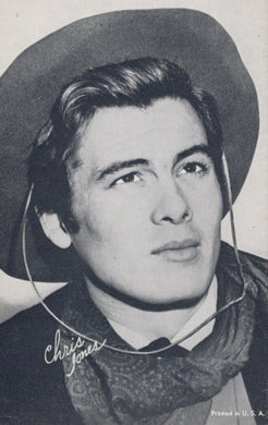Vintage photo of a person wearing a cowboy hat and scarf with 'Chris Jones' signature.