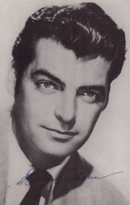 Black and white portrait of a man with a signature at the bottom
