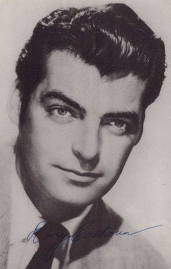 Black and white portrait of a man with a signature at the bottom