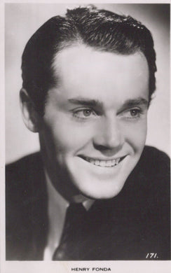 Black and white portrait of a smiling man with text 'HENRY FONDA' at the bottom.