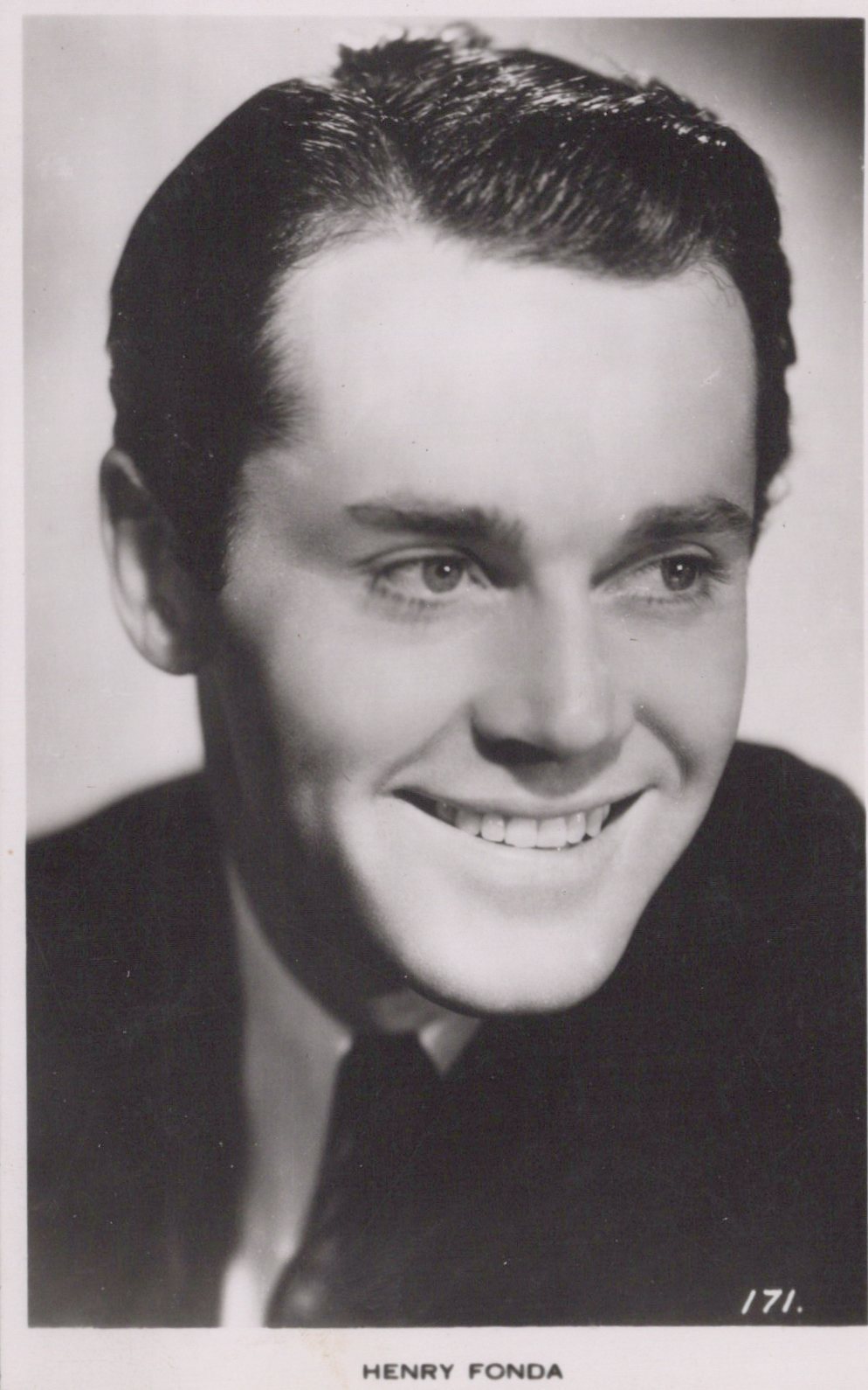 Black and white portrait of a smiling man with text 'HENRY FONDA' at the bottom.