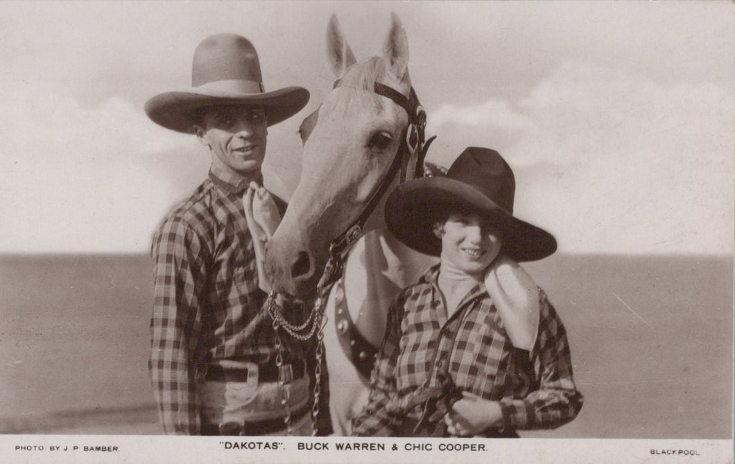 Two people in cowboy hats with a horse, with text indicating 'Dakotas Buck Warren & Chic Cooper'.