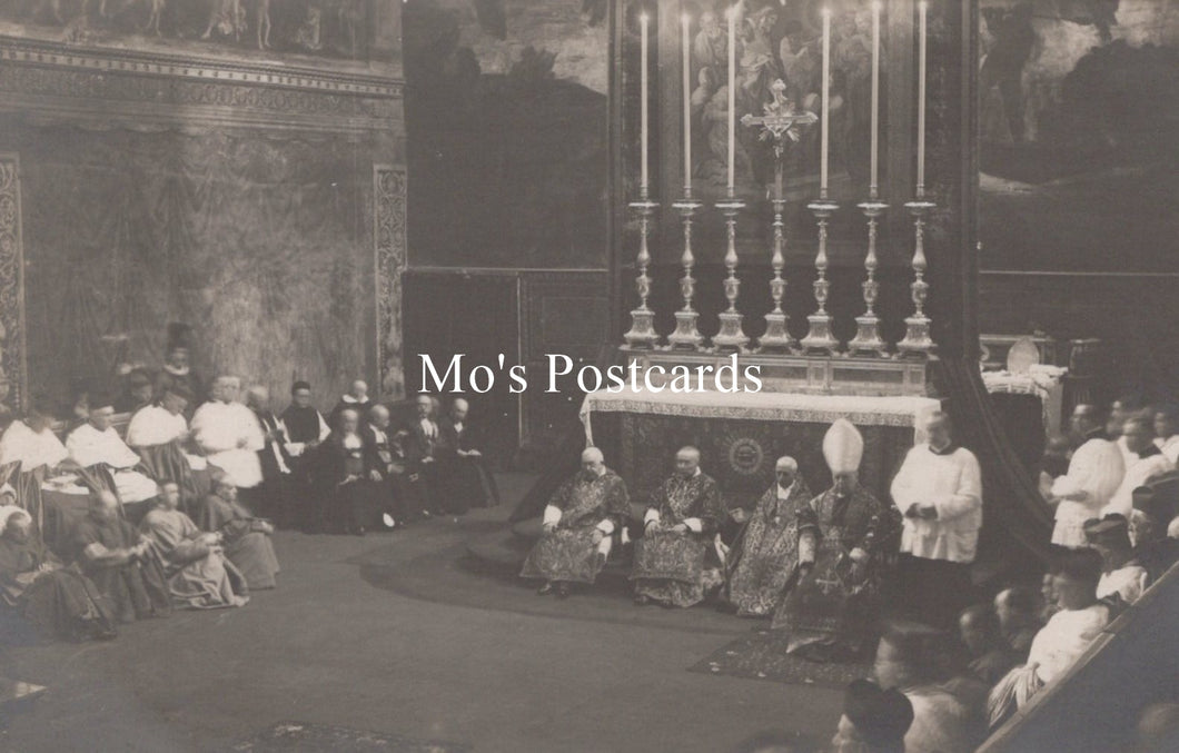 Vintage black and white photograph of a formal event with people seated and standing, possibly in a church or cathedral setting.