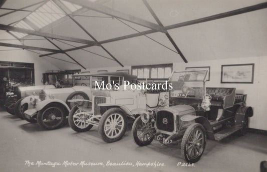 Vintage cars inside a garage at The Montagu Motor Museum, Beaulieu, Hampshire.