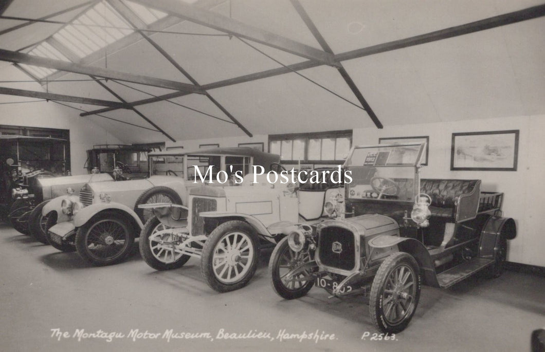 Vintage cars inside a garage at The Montagu Motor Museum, Beaulieu, Hampshire.