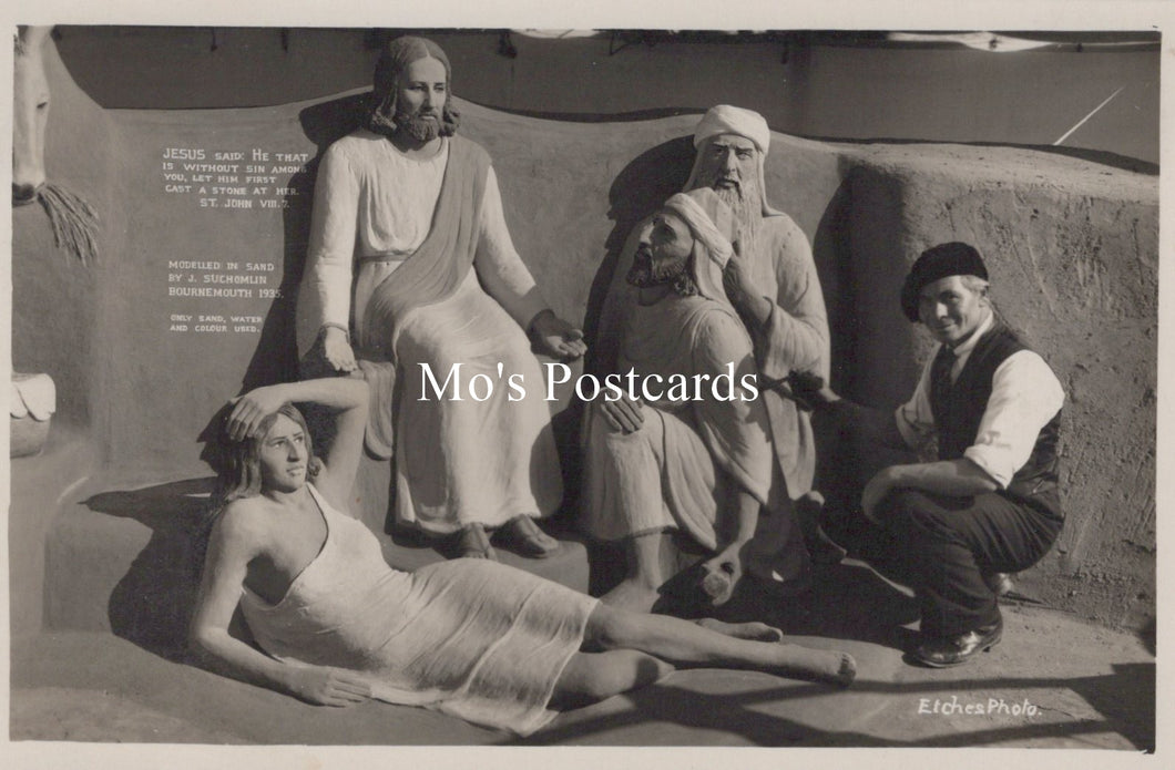 Vintage black and white photo of a group of people posing with statues, labeled 'Mo's Postcards'.