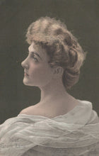 Load image into Gallery viewer, Vintage portrait of a woman with styled hair and a light shawl against a dark background.

