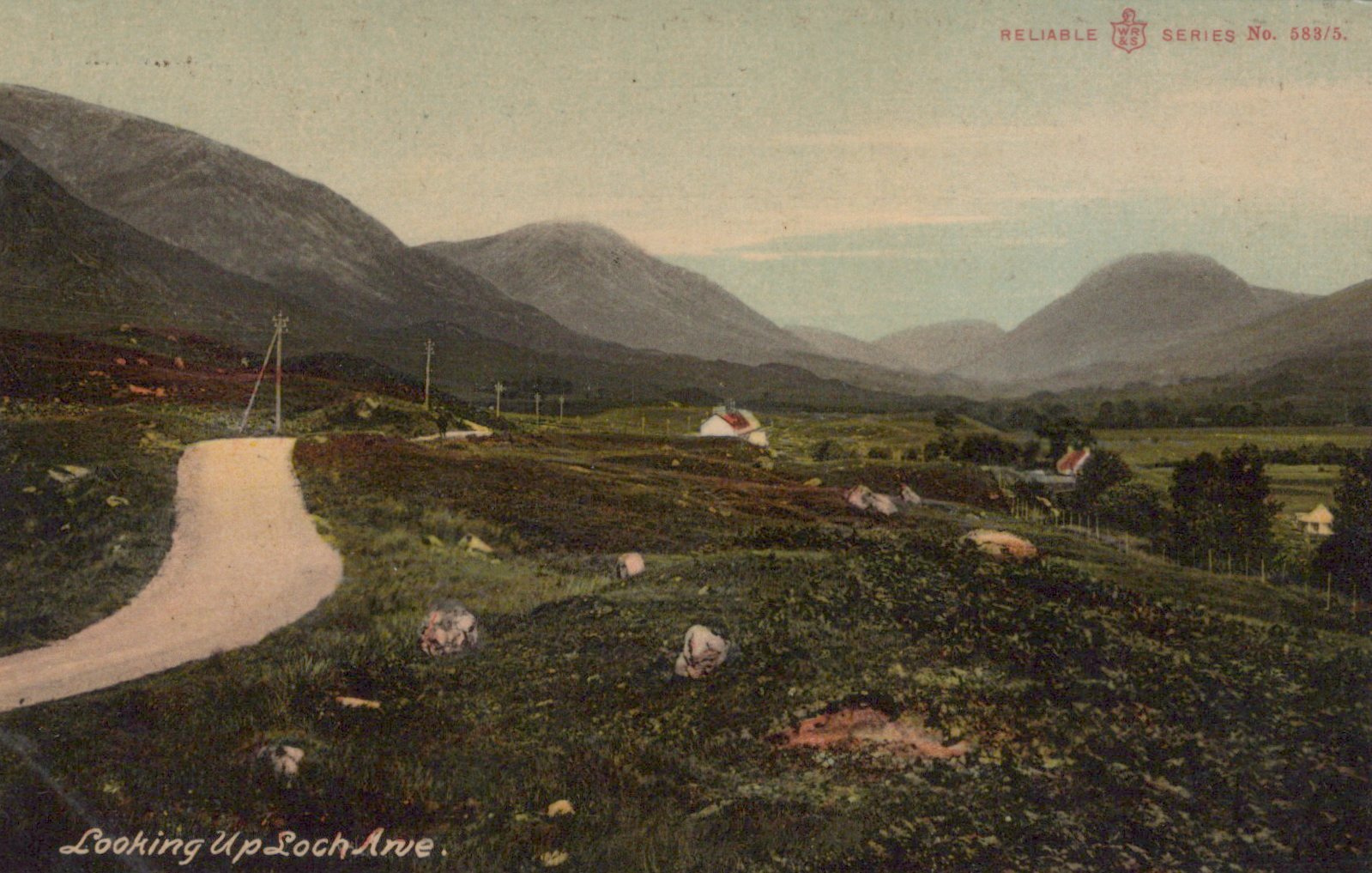 Scenic view of a valley with mountains and a road, featuring sheep and a postcard-like border.
