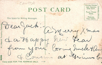 Vintage postcard with handwritten message and stamps