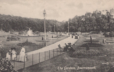 Vintage black and white photograph of The Gardens in Bournemouth with people and fountains.