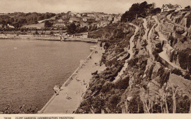 Vintage photograph of a coastal scene with a promenade and cliff gardens.