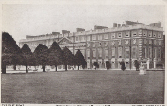 Historical black and white photograph of a large mansion with a well-manicured lawn and trees.