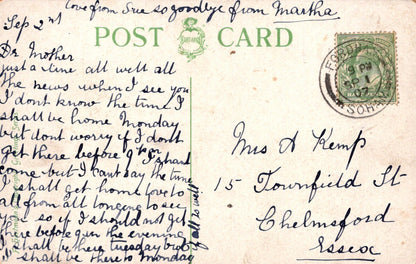Vintage postcard with handwritten text and a stamp, featuring the word 'Postcard' at the top.