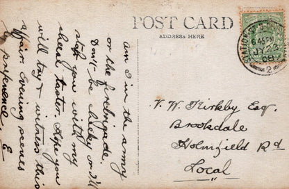 Vintage postcard with handwritten text and a stamp, featuring the word 'Postcard' at the top.