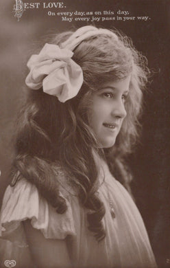Vintage-style portrait of a woman with a large white flower in her hair, with text at the top.