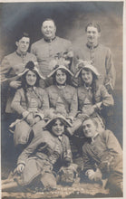 Load image into Gallery viewer, Vintage photograph of a group of people posing together
