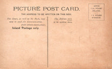 Load image into Gallery viewer, Vintage picture postcard with text and stamps on a brown background
