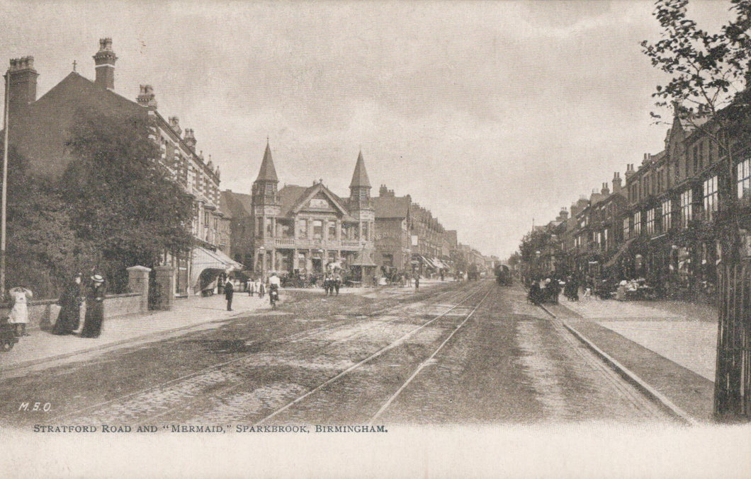 Vintage black and white photograph of a street scene with buildings and tram tracks in Birmingham.