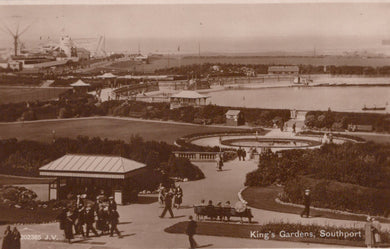 Vintage photograph of King's Gardens in Southport, featuring a park with people and buildings in the distance.