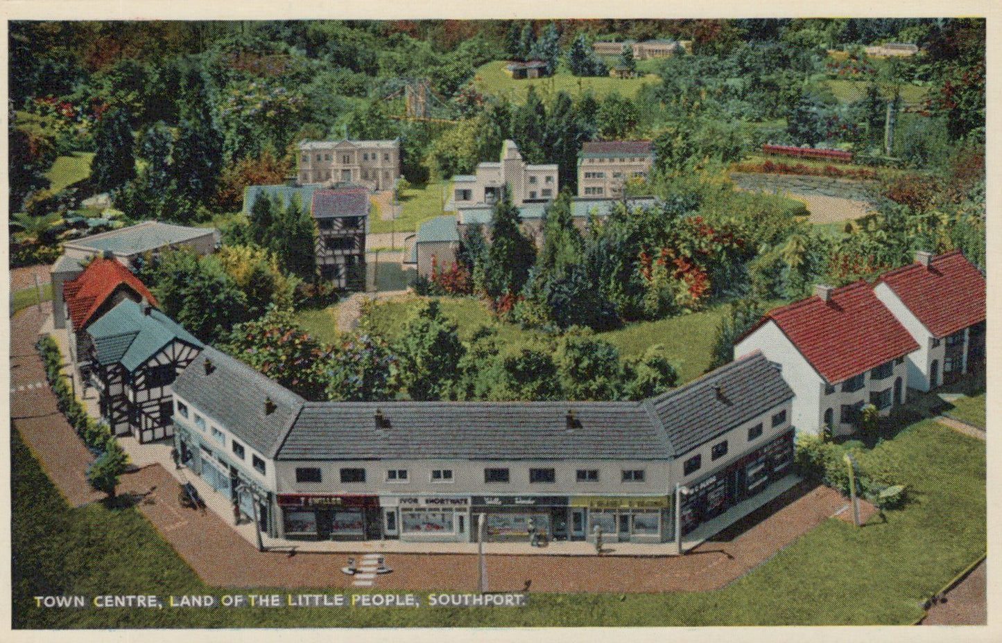 Aerial view of a town center with buildings and greenery, labeled 'Town Centre, Land of the Little People, Southport'.