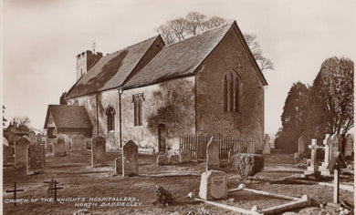 Vintage photograph of a church with gravestones in a cemetery