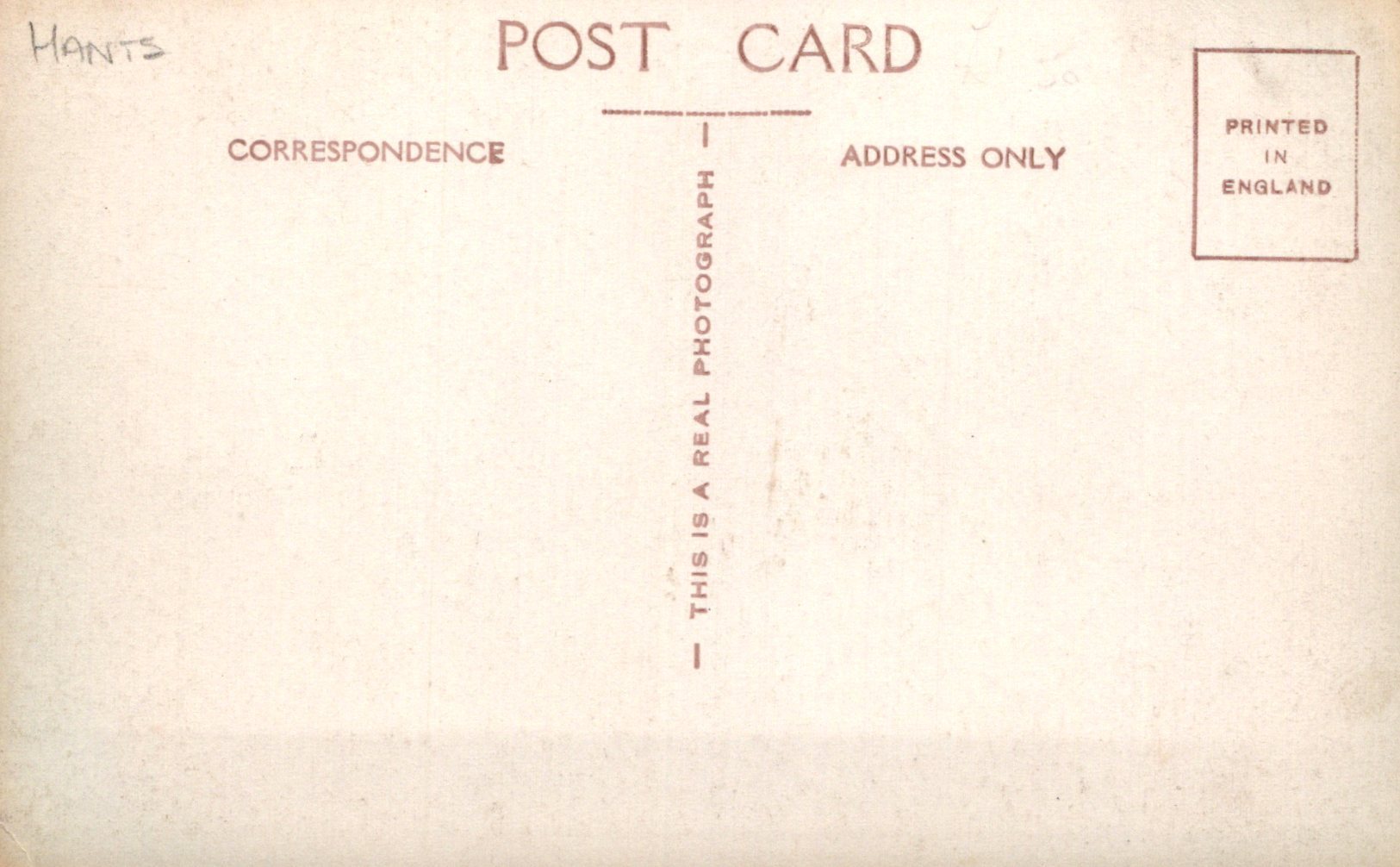 Back of a postcard with text about correspondence and photography, printed in England.
